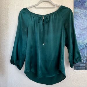 BCX silky emerald green cold shoulder blouse w/ gold accents peep neckline tie